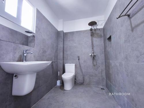a bathroom with a sink and a toilet at The Clifftop Home Deluxe in Esperanza