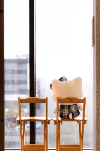 two chairs sitting in front of a window at STAY On-A in Seoul