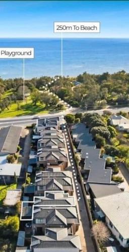 an overhead view of a city with houses and a street at Seaside Luxe at Vila Morava in Rosebud