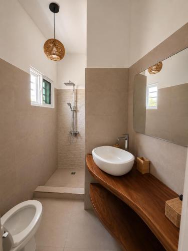 a bathroom with a sink and a toilet at My tropical home in La Laguna