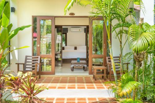 a bedroom in a villa with a bed at EASY TIME VILLA by MARALEINA in Koh Samui