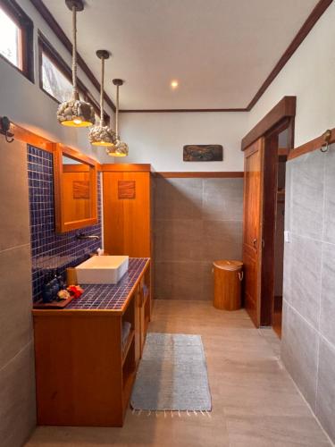 a kitchen with a sink and a counter top at Ombak Biru Resort in Tua Pejat
