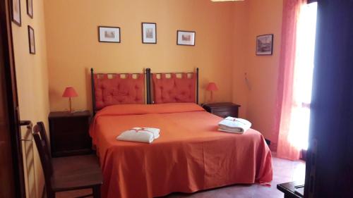 En eller flere senger på et rom på Terre di Gratia Apartments