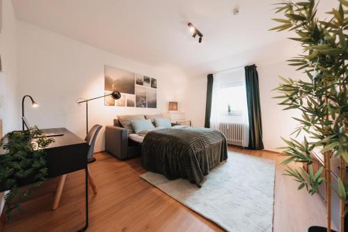 a living room with a bed and a couch at Bright Nest in Drensteinfurt