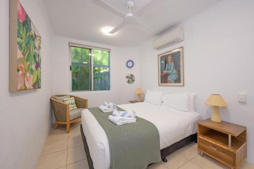 a bedroom with a bed and a table with towels on it at 3WR Sunshine Beach Dream 3BR in Sunshine Beach
