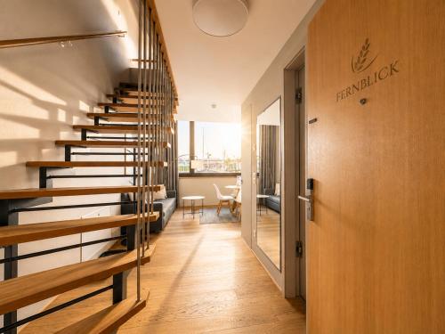 a hallway with a spiral staircase in a building at LAKE-SIDE Fernblick in Romanshorn