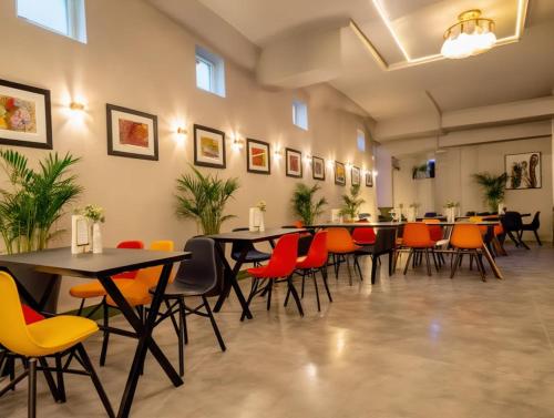 a large room with tables and chairs in it at Hotel The Luxury F S Bliss Most Premium Rooms NearTaj Mahal !!! Best Stay In Agra in Agra