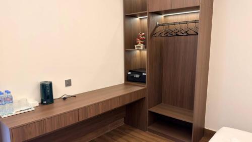 a walk in closet with a desk and a printer at Koh Rong New Beach Resort in Koh Rong Island