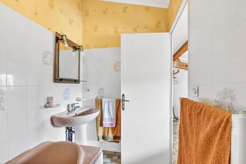 a bathroom with a sink and a mirror at Chambres D'hôtes Des 17 Clochers - in Saint-Vérand