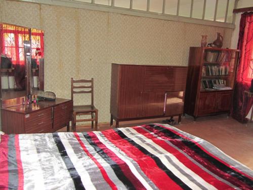 Una cama o camas en una habitación de Guest House Adelina