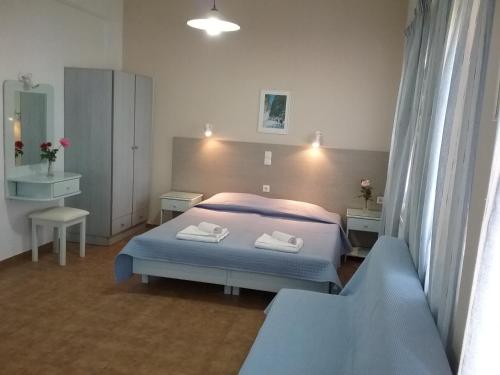 Кровать или кровати в номере Ilona Apartments Chania