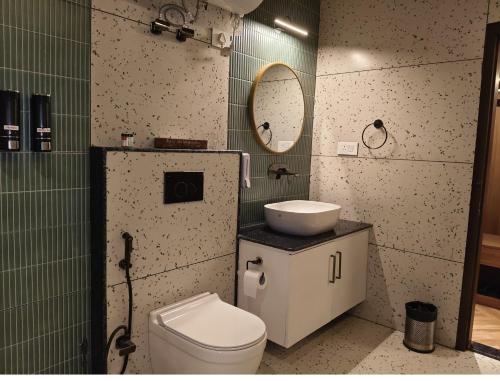 a bathroom with a toilet and a sink at The Yasa Hotel In Gangtok in Gangtok