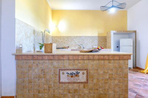 a kitchen with a sink and a counter top at Casa Orizzonte Anglona in Nulvi