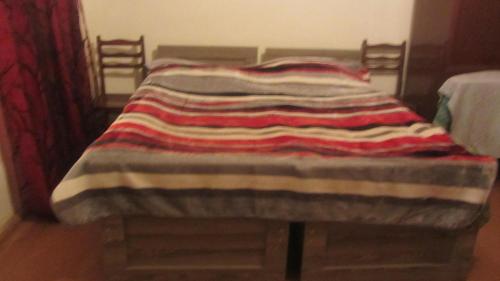 Una cama o camas en una habitación de Guest House Adelina