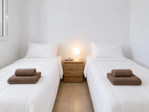 two beds sitting next to each other in a room at Barlovento Apartment 2 in Playa Honda