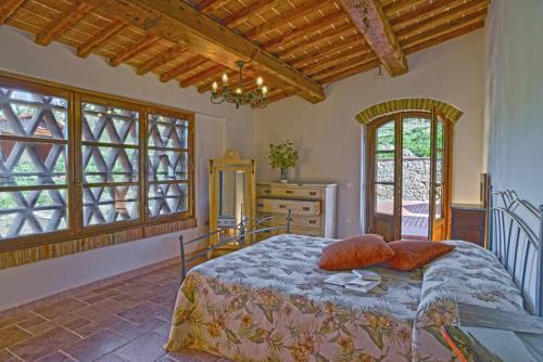 Een bed of bedden in een kamer bij Agriturismo Val di Sterza
