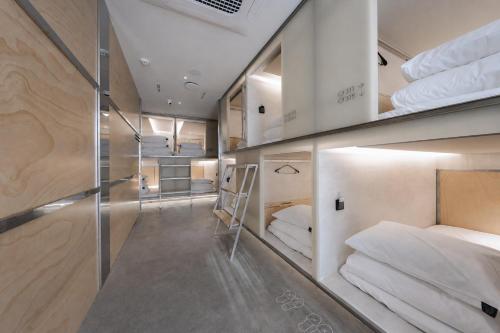 a room with four bunk beds in it at At gangnam seoul in Seoul