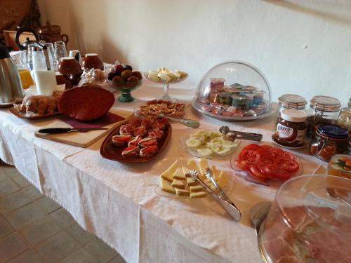 a table with a buffet of food on it at Agroturismo Finca Son Sala in Campos