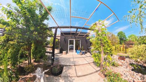 a house with a glass dome in a garden at Garden Residence - The Nest in Drahobudice