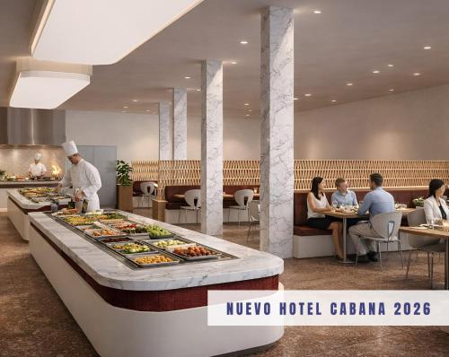 a buffet line with food on it in a restaurant at Hotel Cabana in Benidorm