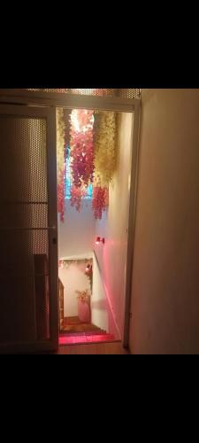 a room with a door with a window with lights at Gandasari homestay banyuwangi in Banyuwangi
