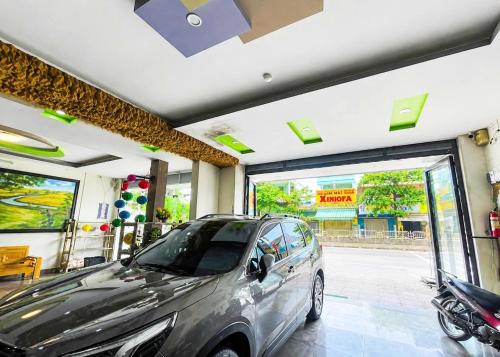 a car parked inside of a garage at Long Khang Hotel in Quang Tri