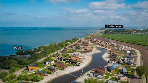 an aerial view of a resort next to the water at Beach House 314 in Hindeloopen