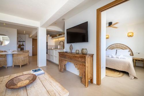 a bedroom with a bed and a television on a wall at Apartment with sea view Javea in Jávea