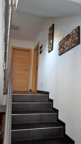 a set of stairs leading up to a door at Haus am Wald in Neustift im Stubaital