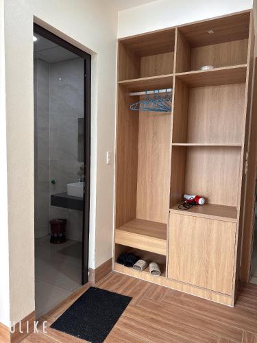 a walk in closet with a glass door at Lala hotel in Phủ Từ Sơn