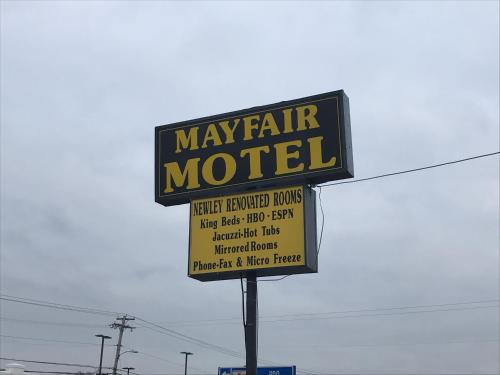 a sign for a may fair motel on a pole at Mayfair Motel in Cross Keys