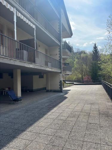 an empty courtyard of a building with a balcony at Vecchio Mulino-Ceci's Flat in Entracque