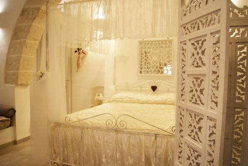 Postel nebo postele na pokoji v ubytování Maruska Residenze
