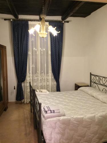 Postel nebo postele na pokoji v ubytování B&B Pozzo dei Desideri