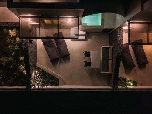 a view of a bathroom with pillows on the wall at Serenity Collection Suites in Karterados