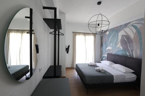 a bedroom with a bed and a mirror at Ferries apartament in Trapani