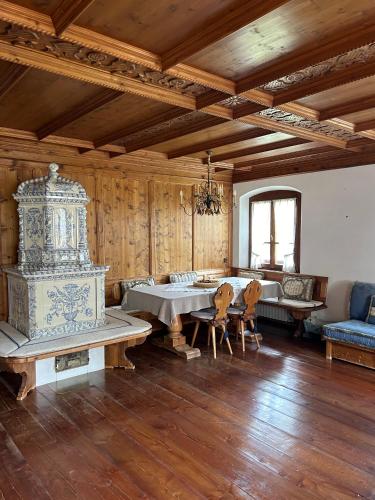 a large room with a table and chairs in it at Panorama Lodge in Cortina dʼAmpezzo