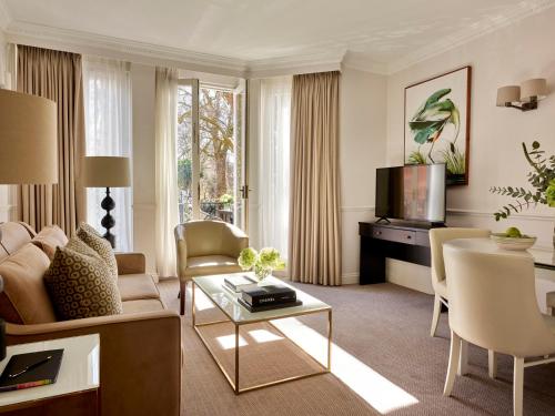 a living room with a couch and a table at Collingham Serviced Apartments in London