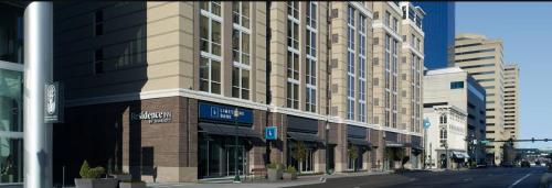 a large building on a city street with buildings at Residence Inn by Marriott Lexington in Lexington
