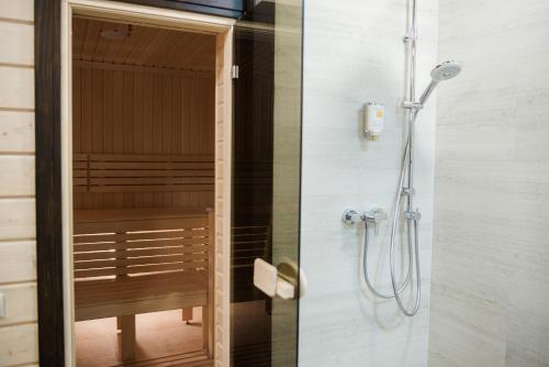 two pictures of a shower in a bathroom at Galant Hotel in Truskavets