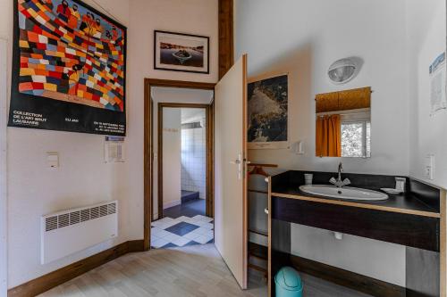 a bathroom with a sink and a counter top at Le Cabanon Mios in Mios