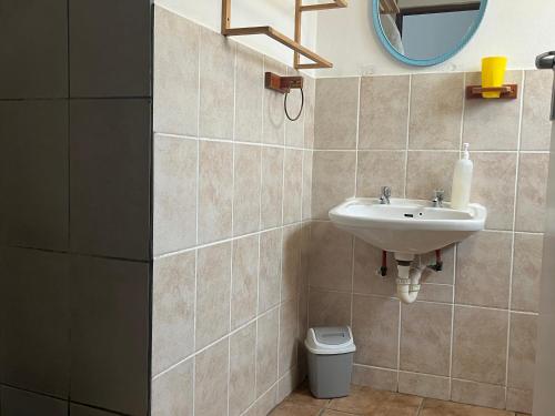 a bathroom with a sink and a toilet at Kelkiewyn Guesthouse Caledon in Caledon