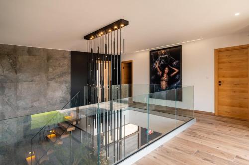 a glass staircase in a house at Villa Signature Luxury & Exclusive seaside getaway in Le Grau-dʼAgde