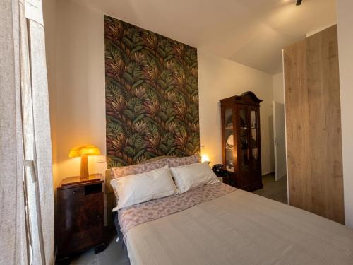a bedroom with a large bed with a wall mural at Camera con Vista in Cervia