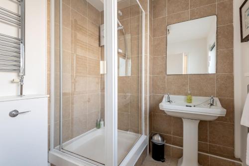a bathroom with a shower and a sink at Kingsmuir - Elie in Earlsferry