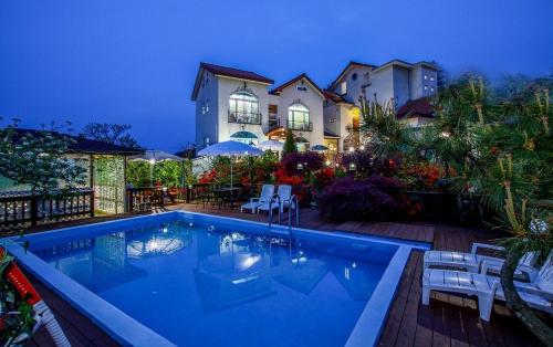 a swimming pool in front of a house at Taean like the first time pension in Taean