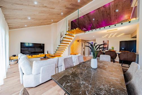a living room with a couch and a table at Villa Anita in Vela Luka