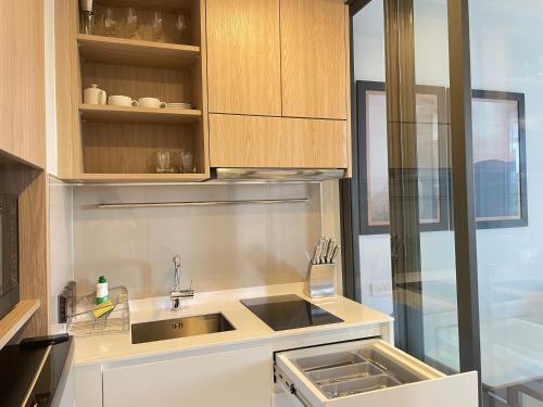 a kitchen with a sink and a counter top at Sky Park Laguna Phuket in Laguna Phuket