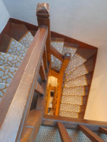 a model of a wooden staircase in a house at lgbt friendly in Dinan