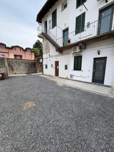 an empty street in front of a building at Volta 15 - 20' Rho Fiera Milano in Senago